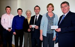 The presentation of proceeds from the Music in May concerts held in Christ Church Parish, Lisburn. From left:  Richard Yarr (organist), the Rev Paul Dundas, Sylvia Creighton, David Robinson (Cancer Services, Belfast City Hospital), Maureen Doran and Tom Doran (Christ Church Challenge - Fund Raising Committee). Photo: John Kelly